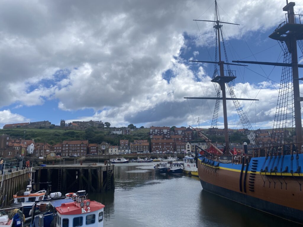 Whitby's harbour filled with fishing boats and the HMS Endeavour.