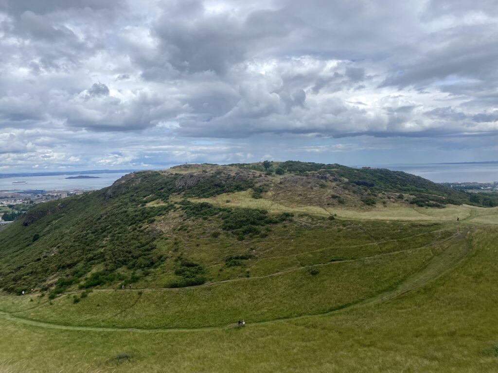 the view from the top of arthur's seat. Large expanse of greenery. 