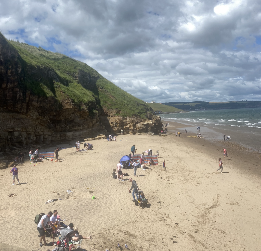 Looking down over Whitby's yellow sandy beach.